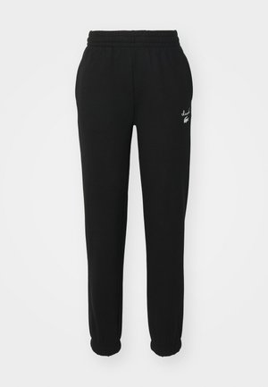 Pantalons de survêtement noirs avec une taille élastique, des poignets ajustés et un logo blanc sur le côté gauche. Fabriqués en matériau doux et texturé.