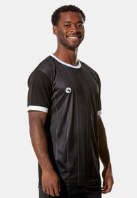 Black athletic shirt with blue vertical stripes, white collar and sleeve accents, featuring a logo on the chest. Suitable for sports activities.