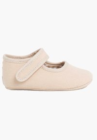 Beżowe płócienne buty Mary Jane z elastycznym paskiem, okrągłym czubkiem i miękką podszewką. Lekka konstrukcja zapewniająca komfort i łatwość noszenia.