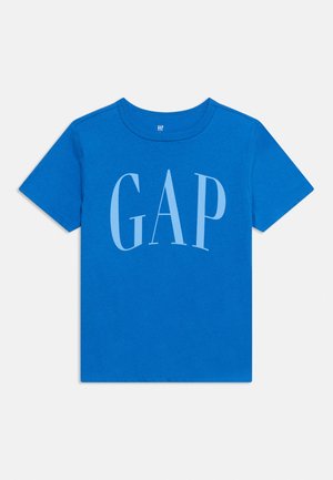 T-shirt bleu vif à manches courtes avec grand logo GAP bleu clair imprimé sur la poitrine, col rond et fond uni.