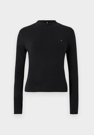 Černý top s dlouhým rukávem a vysokým límcem, vyrobený z hladkého a elastického materiálu. Obsahuje malé logo na levé straně hrudi. Jednoduchý design.