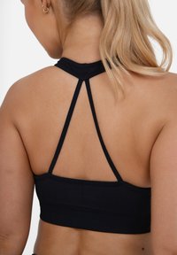 SQUATPROOF Sujetadores deportivos con sujeción media - black