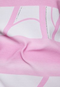 Textured fabric in pink and white with ribbing; features a bold geometric design and small rhinestones along one edge.