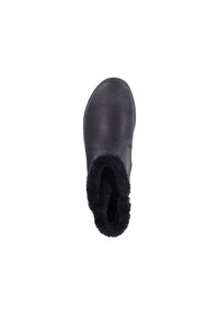 Botte chelsea en cuir noir avec une doublure en fourrure douce noire sur le dessus, présentant un extérieur lisse et un design à orteils ronds.