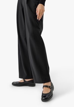 Ballerine con cinturino - schwarz