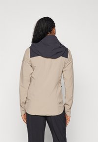 Peak Performance COMMUTER HIPE  - Impermeabile - avid beige/black
