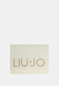 Liu Jo scarf in cream with gold logo detail. Soft fabric, rectangular shape, textured border. Elegant and minimalistic design.