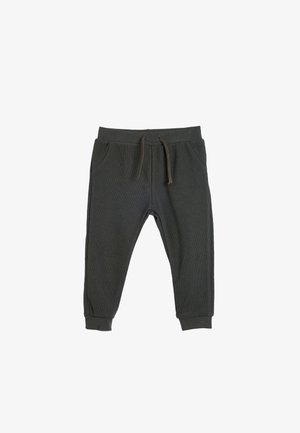 Donkergrijze sweatpants van zacht, geribbeld materiaal. Voorzien van een elastische tailleband met een trekkoord, zijzakken en taps toelopende boorden.