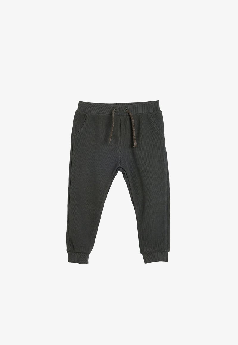 Mørkegrå sweatpants lavet af blødt, ribbet stof. Har en elastisk talje med snoretræk, sidelommer og tapered manchetter.