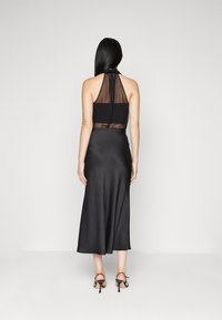 DRYKORN NEVIDA - Maxi skirt - black