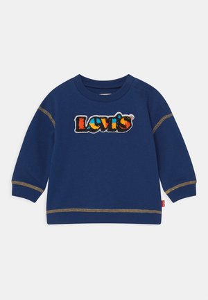 Marineblå langærmet sweatshirt til småbørn med farverig Levi's-logo lapel og gul kontrastsyning på ærmer og kant.