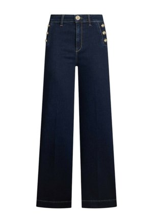 Široke temne kavbojke iz jeansa z visokim pasom, z zlatimi gumbi na strani in vidnimi šivi ob robu.