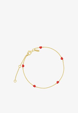 Bracelet en chaîne dorée avec des perles de cœur rondes rouges. Comprend un fermoir en homard et une longueur ajustable avec un petit détail en étiquette.