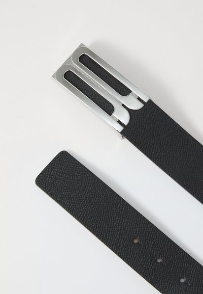Black leather belt with a textured finish, featuring a silver metal buckle with cutouts and engraved details.