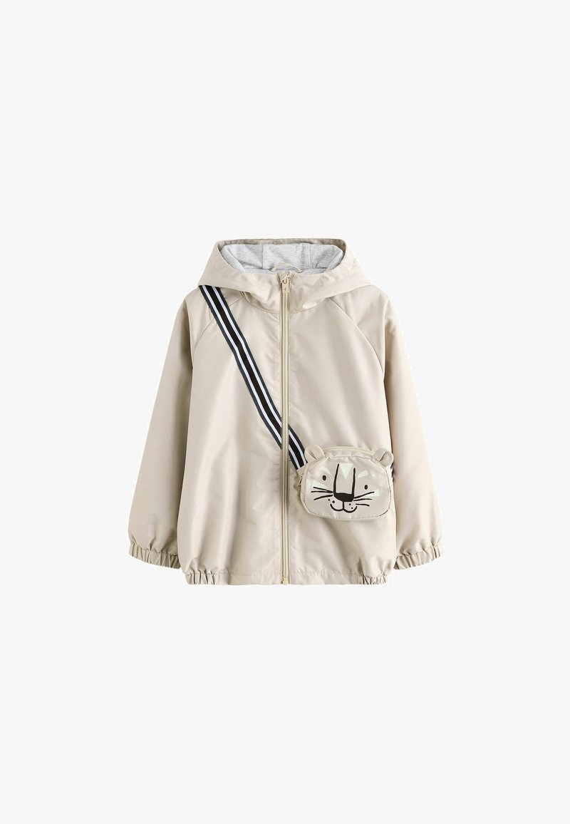 Beige Kapuzenjacke mit Frontreißverschluss und elastischen Bündchen, mit einer kleinen Umhängetasche mit lächelndem Tiergesicht und gestreiftem Träger.