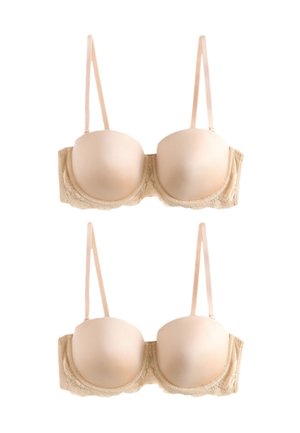 Kaksi beigeä, topattua rintaliivit pitsikoristein ja säädettävillä olkaimilla, kuvattuna edestä ja takaa valkoisella taustalla.