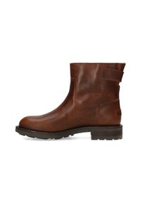Brown leather ankle boot with a rounded toe, side elastic panel, and a back strap detail. Features a thick rubber sole with traction.