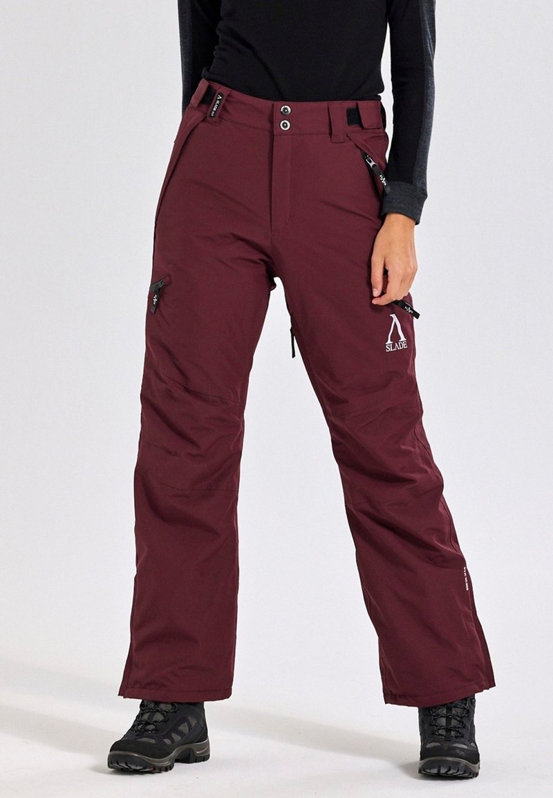 Pantaloni da neve isolati color rosso scuro con design a gamba dritta, tasche con zip, vita regolabile e orli rinforzati. Tessuto resistente per uso all'aperto.