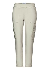 Beiga cargobyxor i mjukt tyg med figurnära midja, fem fickor och en slim fit-design. Justerbara muddar vid anklarna.