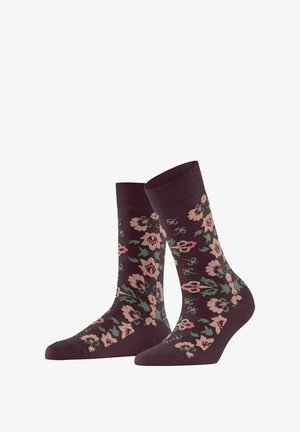 Donkerpaarse sokken met een bloemenpatroon in roze en groen, voorzien van een geribde bovenkant en een gladde textuur. Ontworpen voor comfort en stijl.