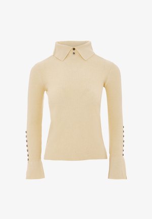 Beige ribbattu neule, jossa on kauluksellinen pääntie, pitkät hihat nappikoristeilla ja levenevät hihansuut. Valmistettu pehmeästä, tekstuuripinnasta.