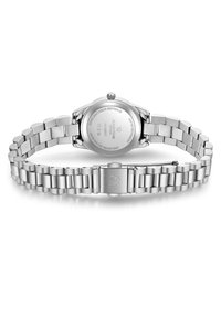 Roostevaba terasest kell, millel on poleeritud hõbedane viimistlus, ümmargune korpus ja lingitud käevõru. Tagakülg on graveeritud spetsifikatsioonide ja logoga. Veekindel kuni 3 ATM.