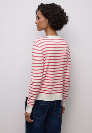Striped sweater in cream and pink, with a crew neck and ribbed cuffs. Features a relaxed fit, soft texture, and drop shoulders.