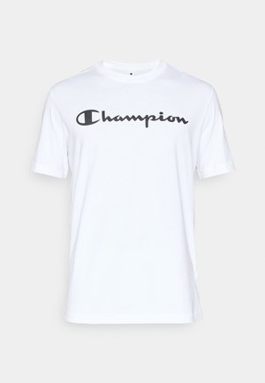 Hvit bomull t-skjorte med korte ermer, med en svart kursiv "Champion" logo over brystet. Rund hals og avslappet passform.