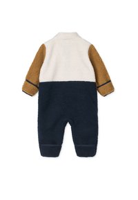 Fleece-Overall in Creme, Braun und Marineblau. Verfügt über einen Kragen, strukturierten Stoff, lange Ärmel und elastische Bündchen an den Knöcheln.