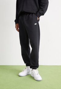 New Balance - SPORT ESSENTIALS - Tracksuit bottoms - black Thumbnail Image 1