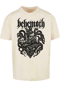Behemoth grafisk t-shirt i cremefarvet, med et detaljeret sort tryk af et kranium, slanger og et øje inden i en trekant. Kortærmet design.