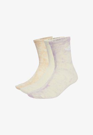 Drei Paar Baumwollsocken im Crew-Stil in sanften Pastellfarben: hellpfirsich, creme und lavendel, mit gerippten Bündchen und Batikmustern.