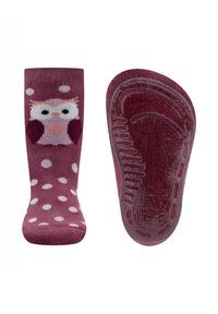 Fuchsia Socken mit weißen Punkten und einem Eulendesign auf der Vorderseite. Die Sohle hat ein strukturiertes Griffmuster für besseren Halt.