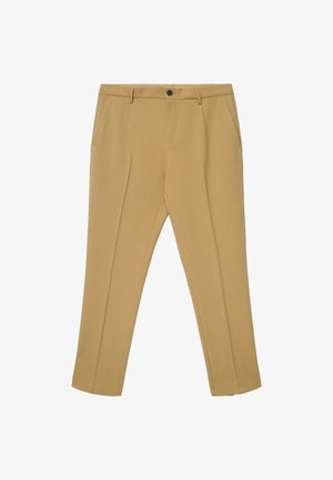 Pantalon beige sur mesure en tissu lisse, avec devant plat, passants de ceinture, poches latérales et fermeture à un bouton.