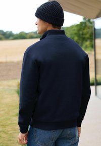 Next Kardiganas - navy borg lined