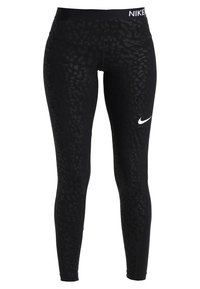 Černé legíny s texturovaným zvířecím potiskem, elastickým materiálem, vysokým pasem s logem Nike a bílým ikonickým vzorem na nohavici.
