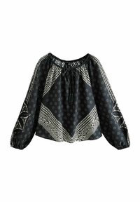 Blouse noire à coupe ample, à manches longues bouffantes, avec un col à cordon, et des motifs géométriques et floraux blancs. Tissu doux avec un léger éclat.