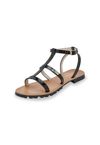 Black patent leather sandal with multiple straps, a padded insole, and a textured rubber sole; features an ankle strap with a metal buckle.