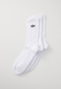 Weiße Baumwollsocken mit gerippter Textur, die auf einer Seite ein kleines schwarzes Logo aufweisen. Drei Paar, alle im gleichen Design.