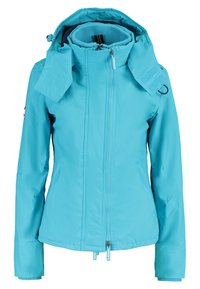 Lichtblauwe waterdichte jas met capuchon, ritssluiting aan de voorkant, elastische manchetten en een gestructureerde voering aan de binnenkant. Voorzien van klittenbandaccenten en een logopatch.