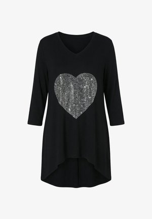 Black tunic with a V-neck and three-quarter sleeves. Features a large silver rhinestone heart design on the front. Soft, flowing fabric.