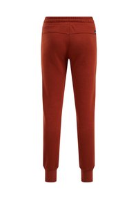 Bomullsjoggers i en bränd orange färg med en tapered fit, elastisk midja och ribbade ankle cuffs. Enkel bakfickdetail inkluderad.