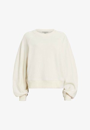 Felpa accorciata di colore crema, con collo rotondo, polsini a costine e maniche a palloncino. Tessuto liscio con decorazioni minime.