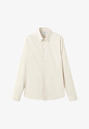 Světlá béžová košile s dlouhým rukávem z hladké látky, má klasický límec, zapínání na knoflíky a volný střih s zaobleným spodním lemem.