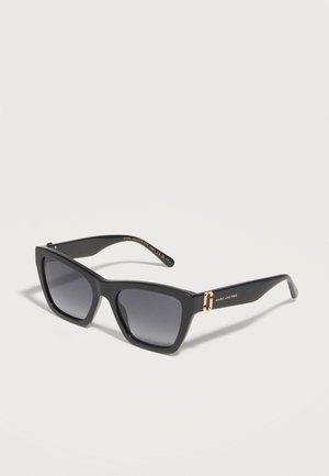 Black rectangular Marc Jacobs sunglasses with dark gradient lenses and gold logo accents on the temples, angled on a white background.