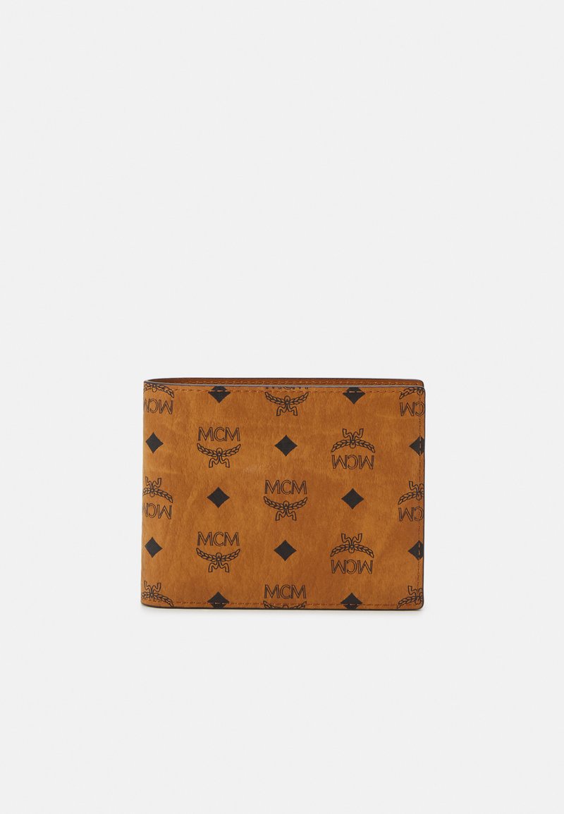 Brown leather wallet with black MCM logo pattern, diamond accents, and stitched edges. Features a rectangular shape with a smooth texture.