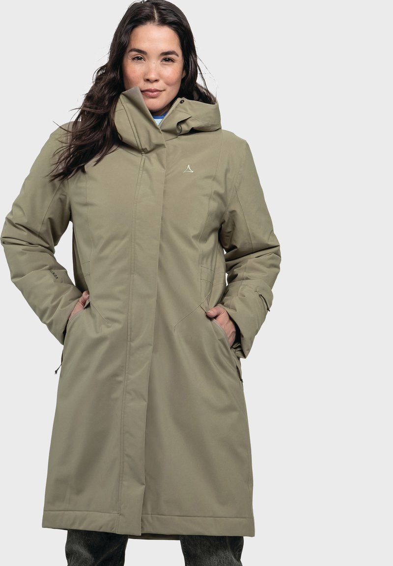 Olivgrüne, knielange Jacke mit hohem Kragen, Reißverschluss vorne und Seitentaschen. Sie verfügt über ein dezentes Logo auf der Brust und eine glatte Textur.