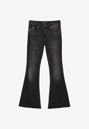 Svarta denim-bucklare med medelhög midja, med fem fickor, kontrasterande sömnad och detaljer i silverfärgad metall.