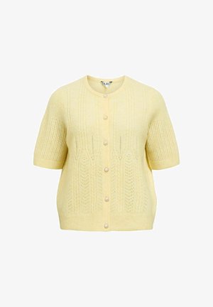 Lühikeste varrukatega kollane kardigan ümmarguse kaelusega, millel on põimimismuster ja pärlienõmblused ees. Pehme tekstuur, kerge materjal.