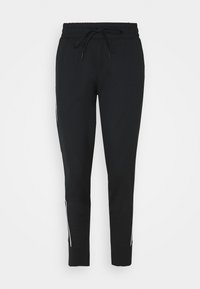 Svarta mjukisbyxor med elastiskt midjeband, snörning och vita sidränder. Tillverkade av ett mjukt, flexibelt material. Smal ben-design.